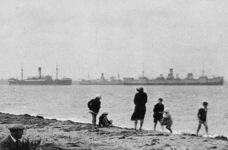 Part of a photograph of The Shore, Bradwell on Sea, taken 1931-32. The vessels shown are thought to be a Blue Funnel liner, probably JASON, liner (7 May 1931 - 20 Sep 1931), PORT CURTIS and HIGHLAND WARRIOR. HIGHLAND WARRIOR left the river 7 December 1932. Date: cAugust 1931.